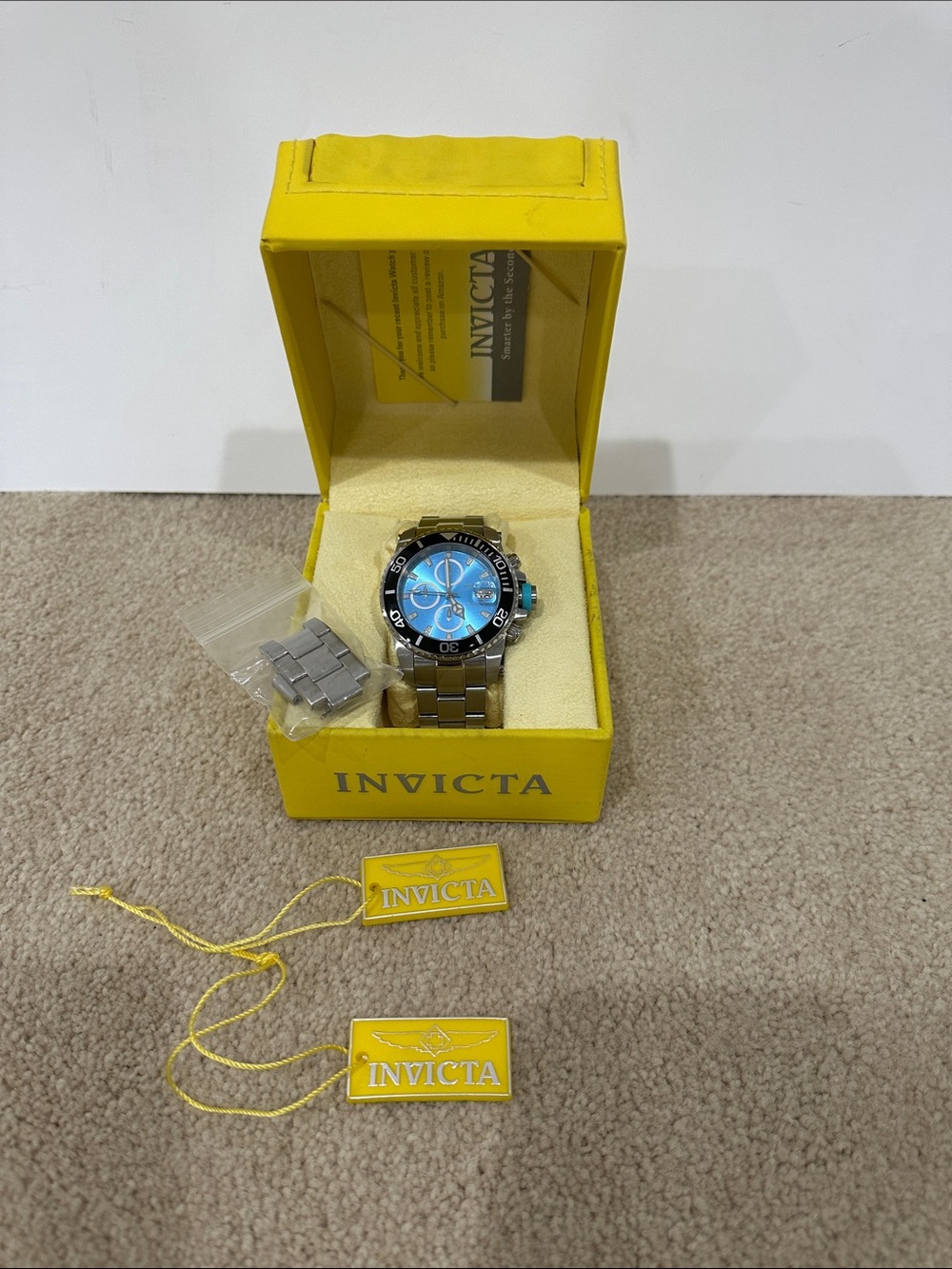 Invicta Men’s Silver Stainless Steel Watch with Blue Dial and Black Bezel